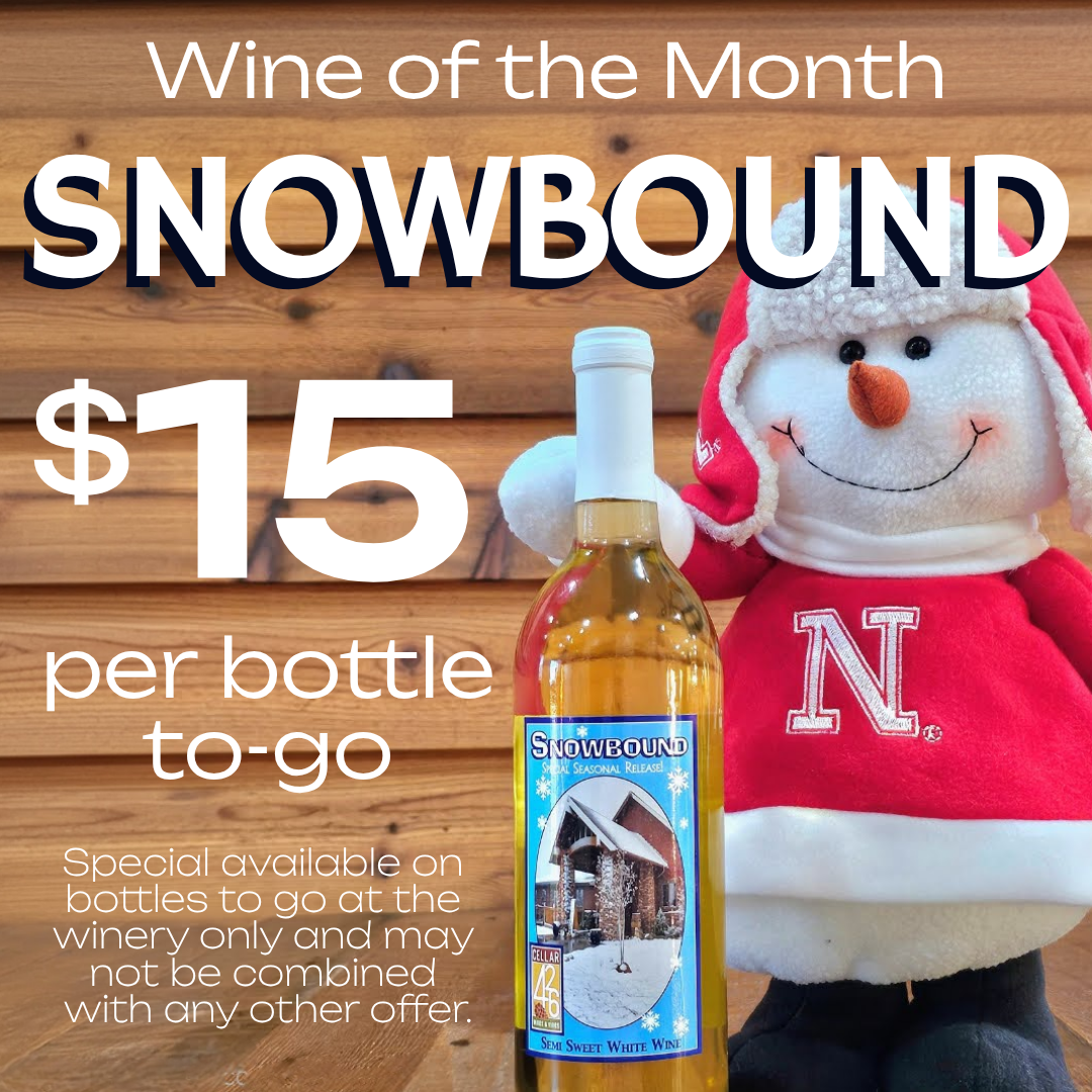 Husker snowman with a wine bottle
