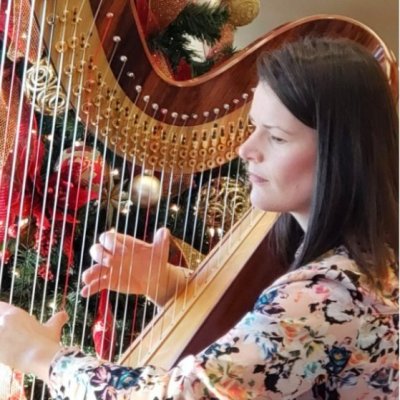 A woman playing the harp
